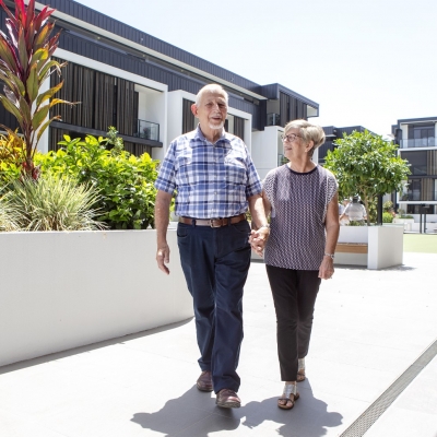 Senior couple is walking in the Village